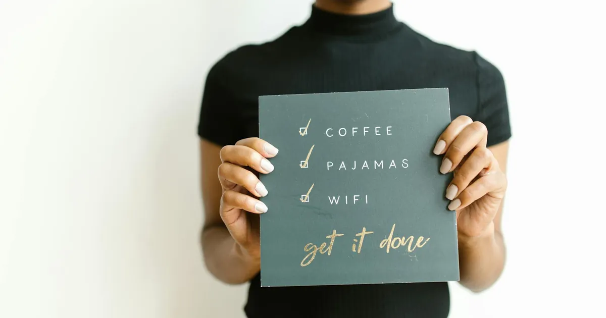 Woman holding a motivational checklist sign with simple tasks and goals. Woman holding a motivational checklist sign with simple tasks and goals.