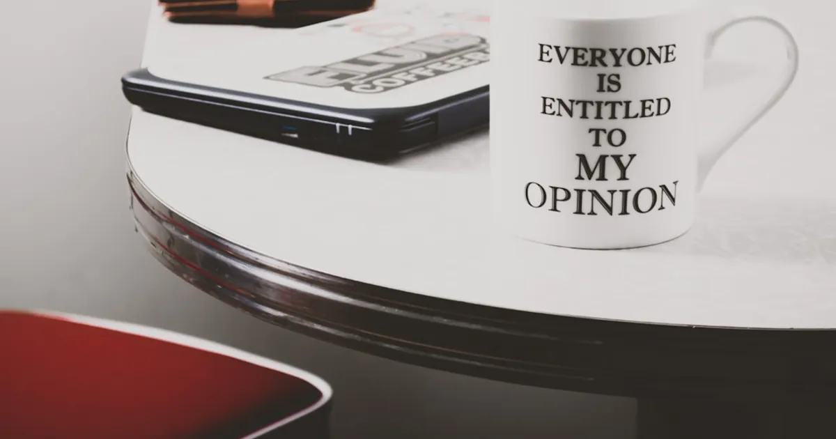 white ceramic mug on table