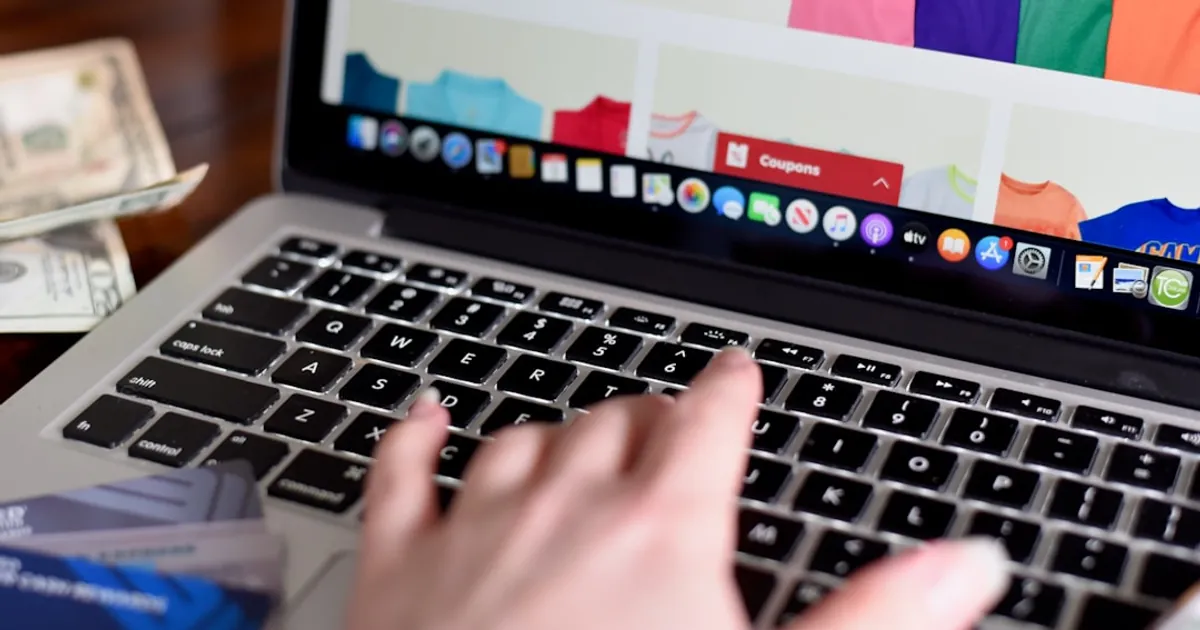 person using macbook pro turned on displaying game application