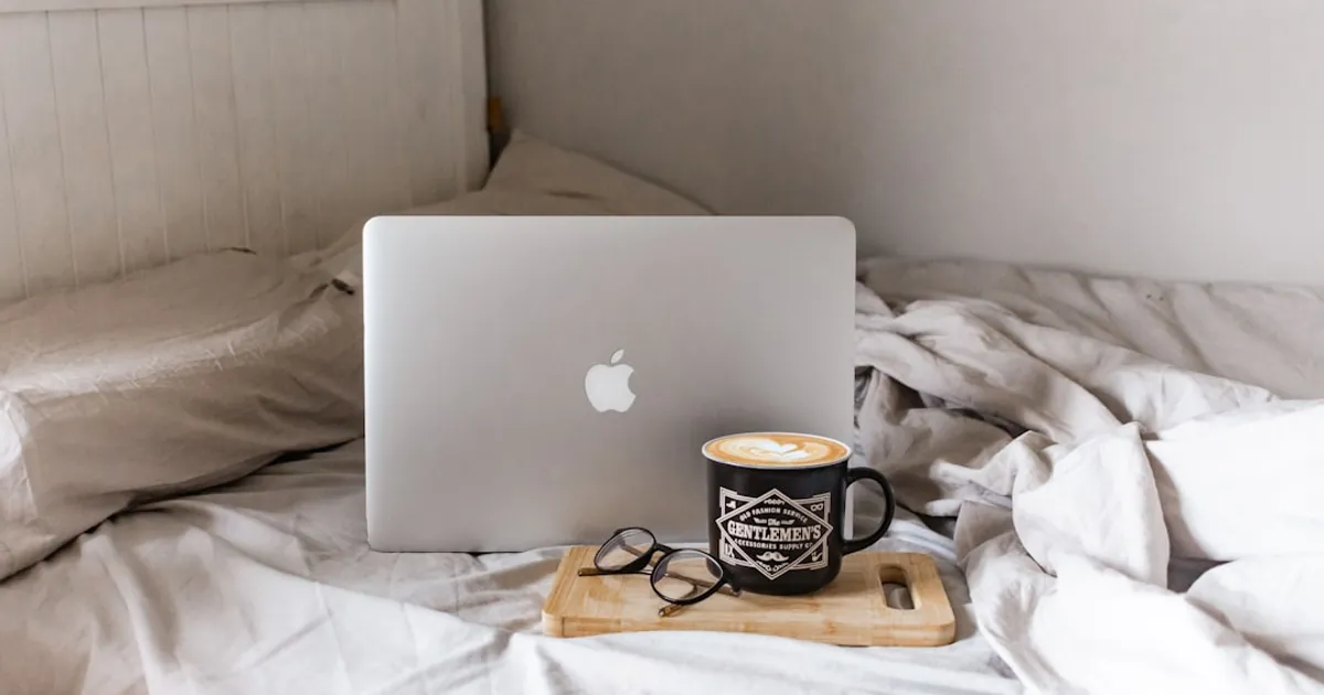 macbook air on brown wooden table