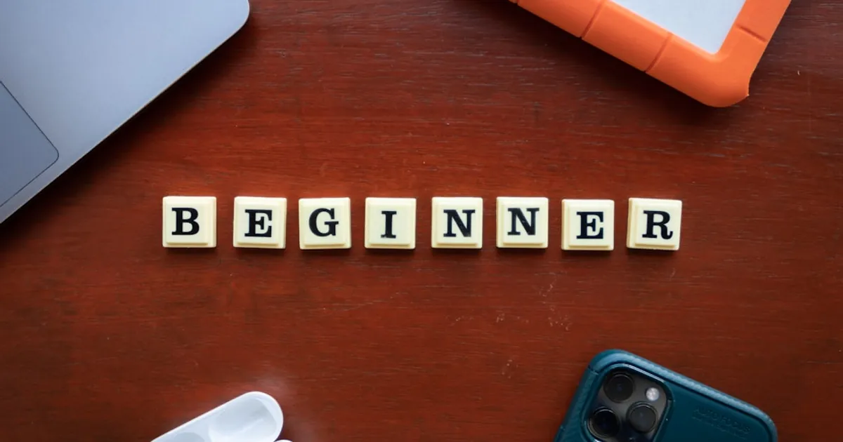 a wooden block spelling out the word begin
